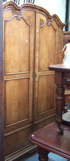 Appraisal: A th century walnut framed wardrobe the shaped and moulded