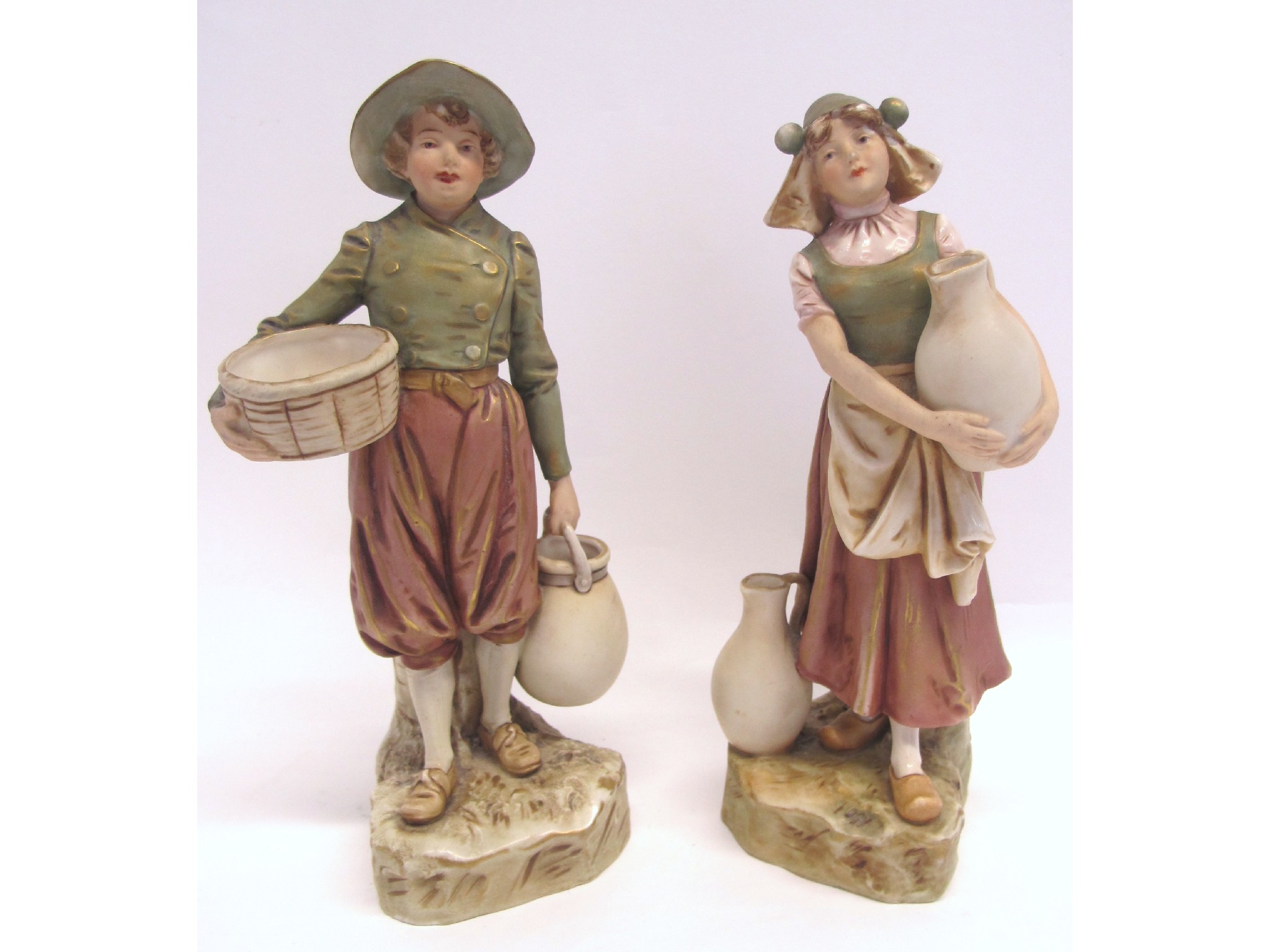 Appraisal: Pair of Royal Dux figures boy marked girl marked