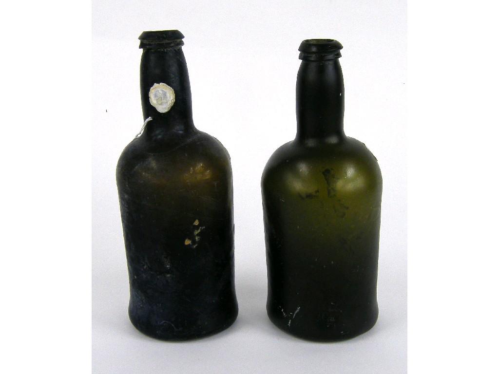 Appraisal: Two similar Diana Cargo cylindrical iridescent port glass bottles circa