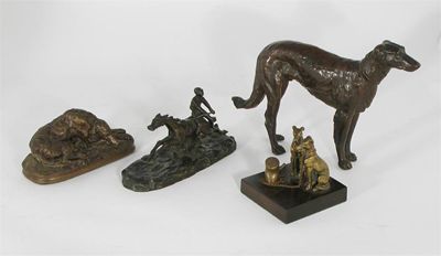 Appraisal: A bronze group of two seated whippets leashed to a