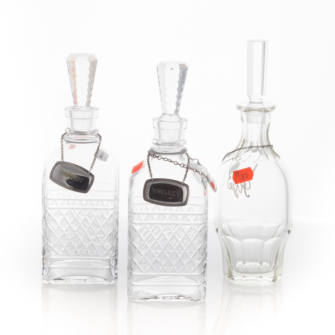 Appraisal: Three glass decanters with sterling labels