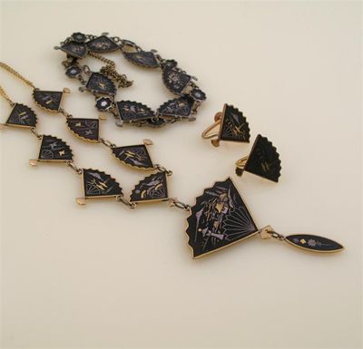 Appraisal: A th century Shakudu necklace the inlaid fan-shape plaques set