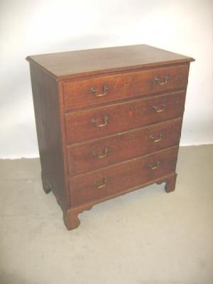 Appraisal: AN OAK CHEST of four graduated drawers with moulded edged