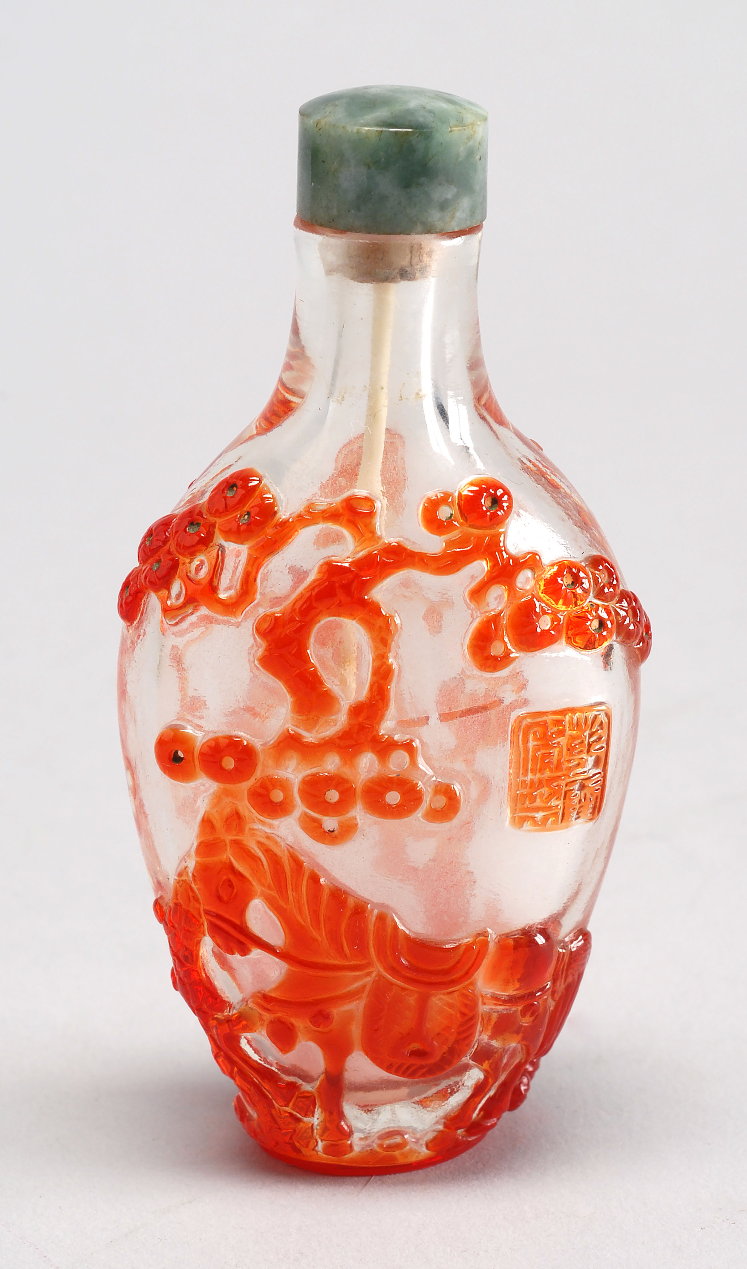 Appraisal: OVERLAY GLASS SNUFF BOTTLE th CenturyIn spade shape with bird