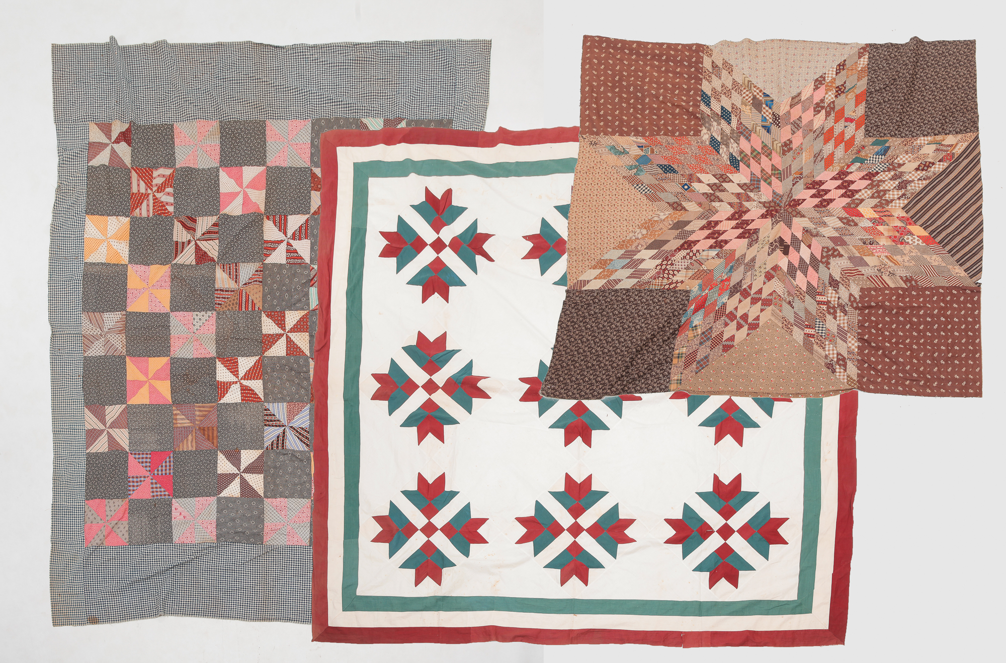 Appraisal: THREE AMERICAN QUILT TOPS Second half th century Tulip variant