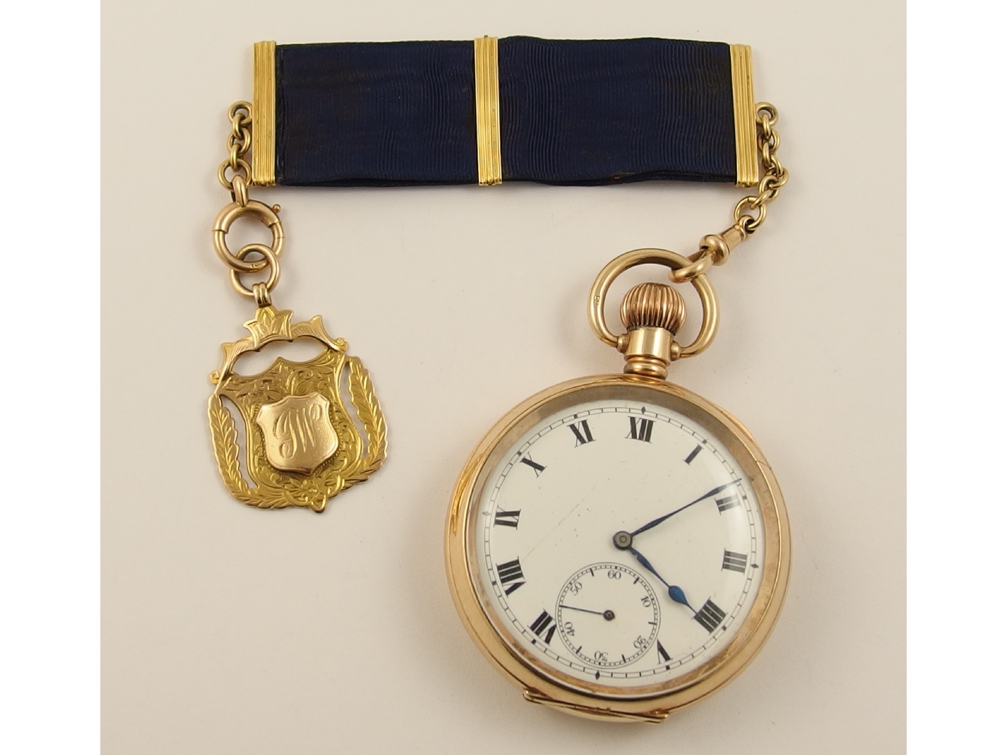 Appraisal: A gold plated pocket watch with a ct mounted fob