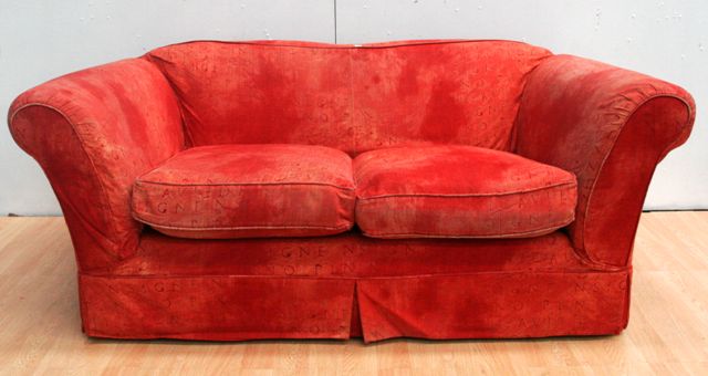 Appraisal: A two seater sofa with red upholstery