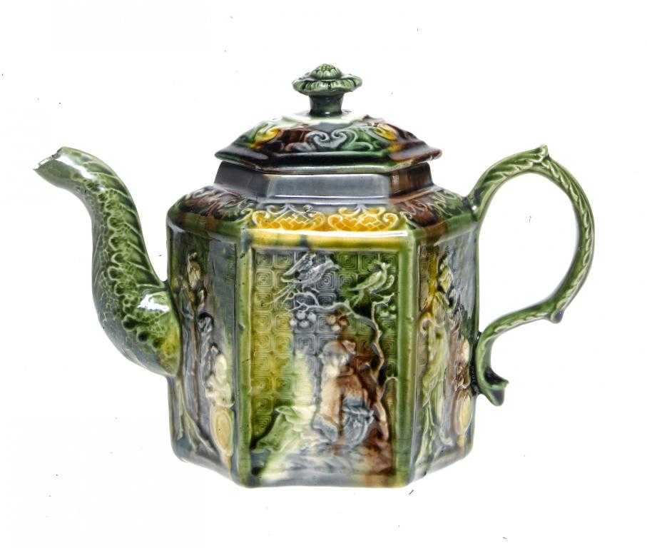 Appraisal: A STAFFORDSHIRE LEAD GLAZED CREAMWARE CHINOISERIE MOULDED HEXAGONAL TEAPOT AND