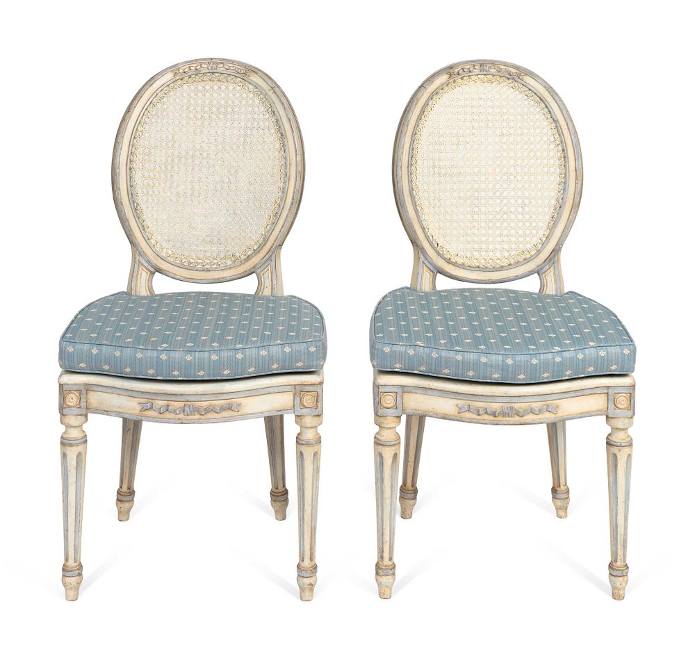 Appraisal: A Pair of Louis XVI Style White-Painted and Caned Chaises