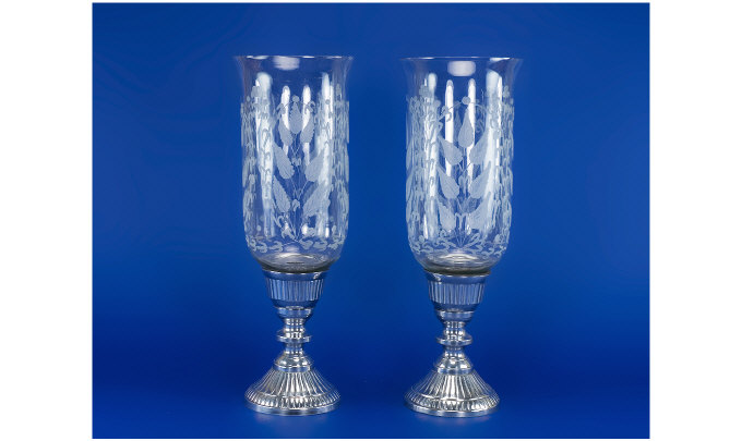 Appraisal: Pair of Large Glass Metal Based Candle Holders The glass