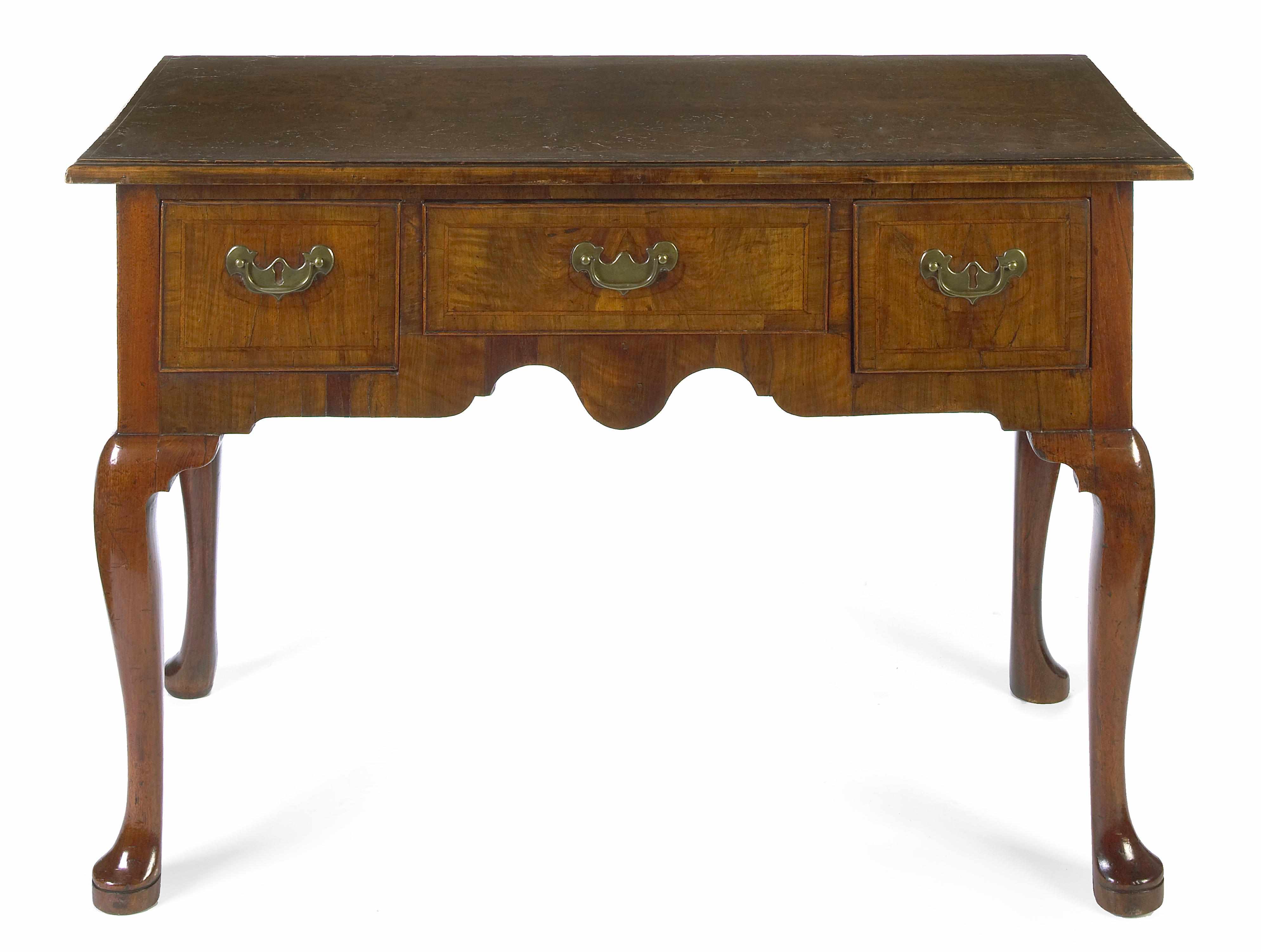 Appraisal: A George II walnut lowboy second quarter th century The