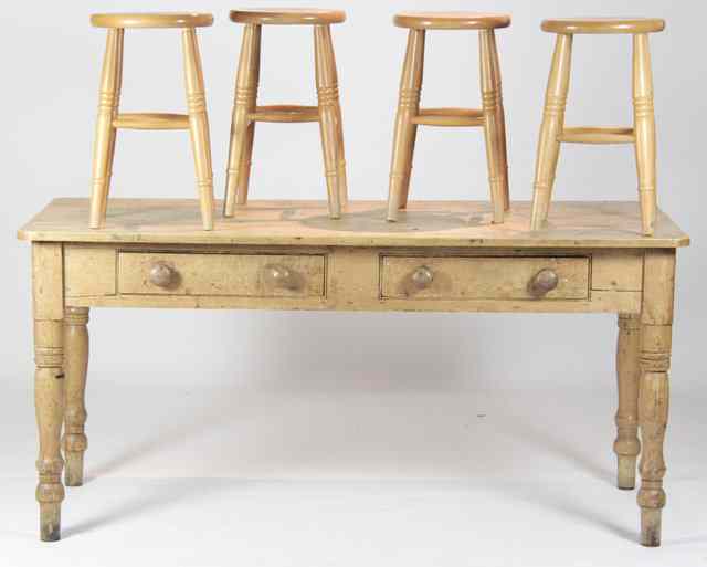 Appraisal: A pine kitchen table with two drawers on turned tapering