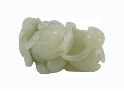 Appraisal: A Chinese pale celadon jade carving of a recumbent lion