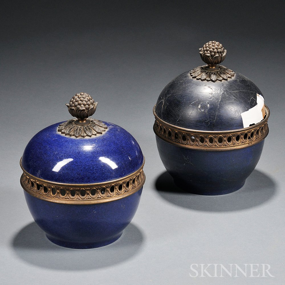 Appraisal: Two Blue-glazed Covered Jars with Gilt-metal Finials China globular with