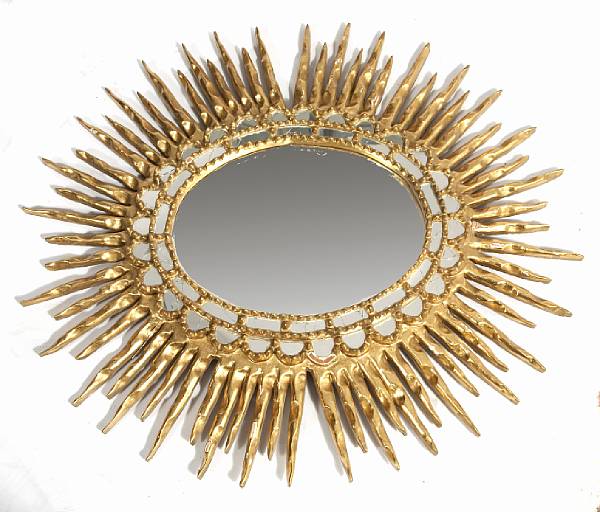 Appraisal: A Spanish Baroque style carved giltwood sunburst mirror height in