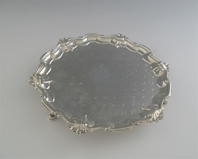 Appraisal: A Victorian small salver with a shell and scroll border