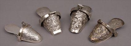 Appraisal: THREE LATIN AMERICAN REPOUSS SILVER STIRRUPS AND A MODERN PERUVIAN