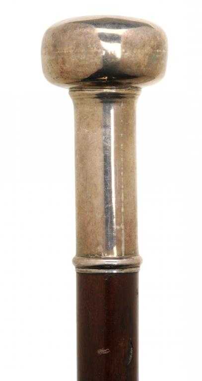 Appraisal: A VICTORIAN SILVER-MOUNTED MAHOGANY WALKING CANE with long moulded ferrule