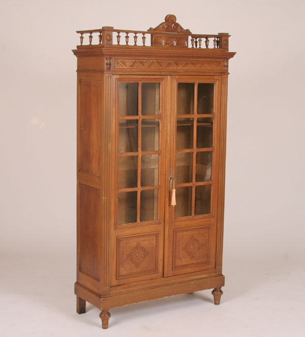 Appraisal: Victorian glass front bookcase beveled glass frames eight light blunted