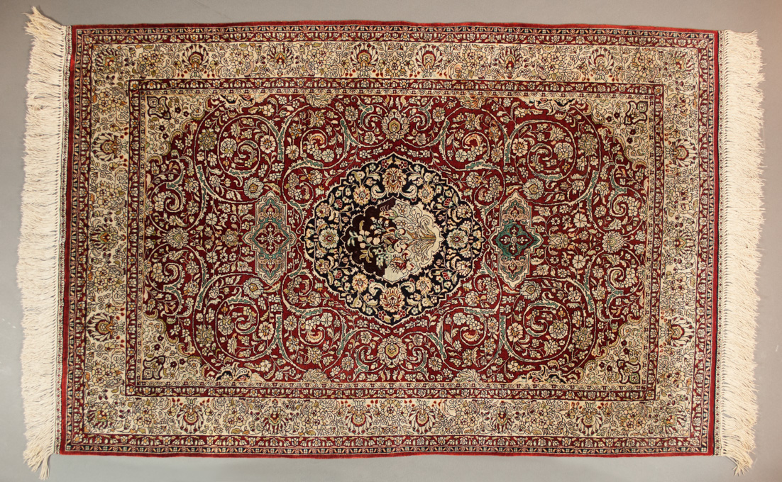 Appraisal: A CONTEMPORARY SILK SINO-PERSIAN AREA RUG floral and central floral