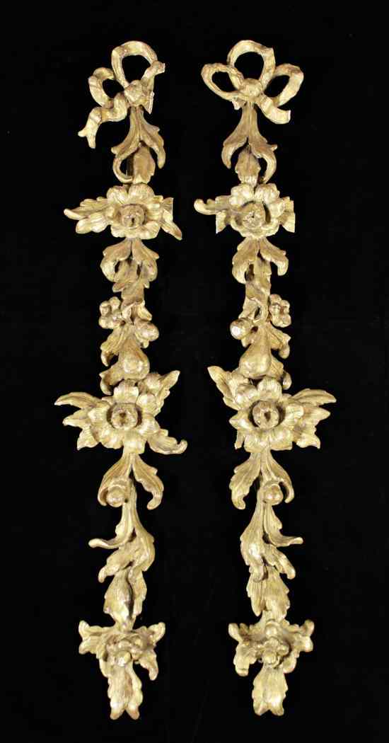 Appraisal: A pair of th century carved and giltwood wall appliques