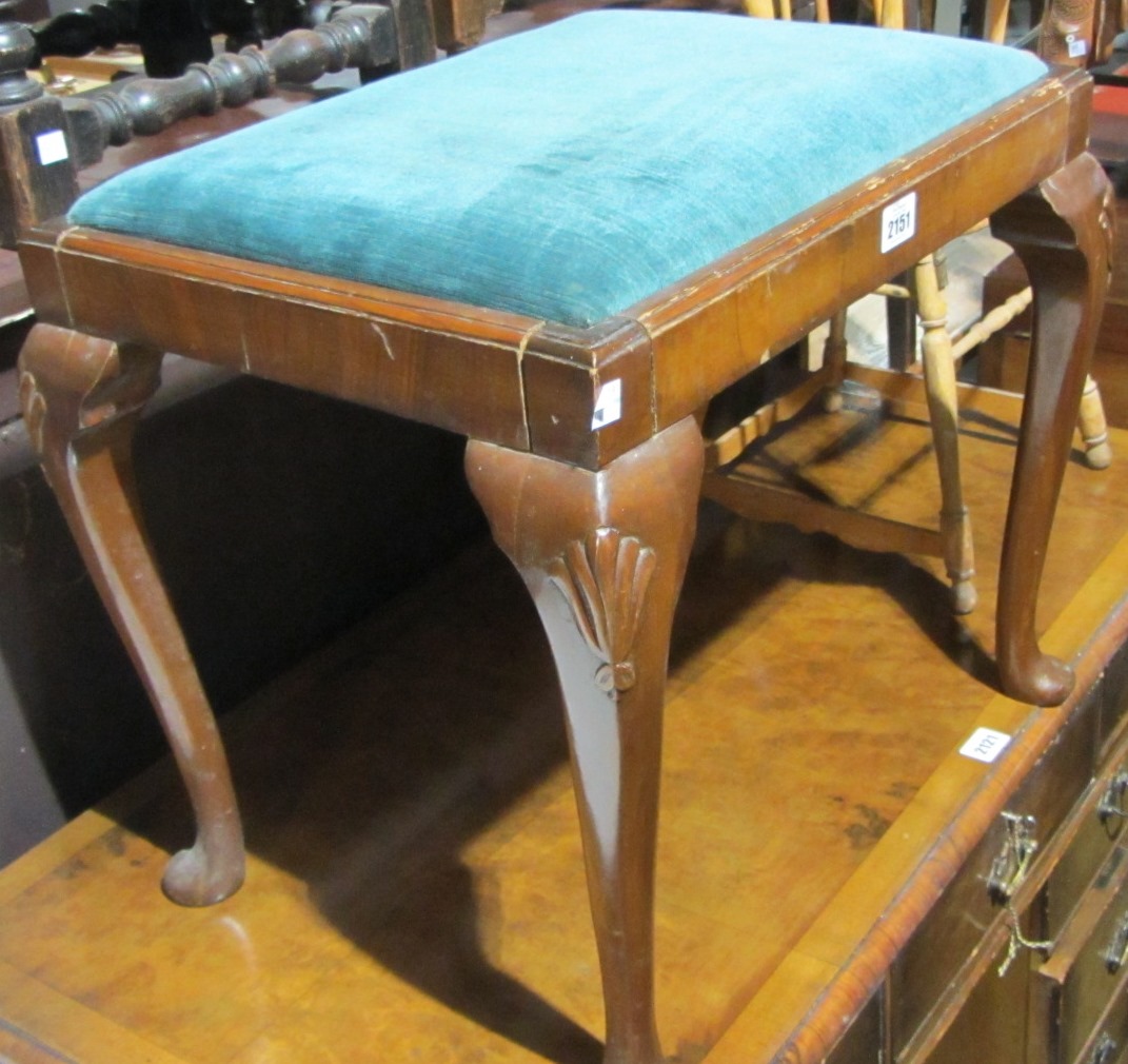 Appraisal: A mahogany footstool on cabriole legs and a brass coal