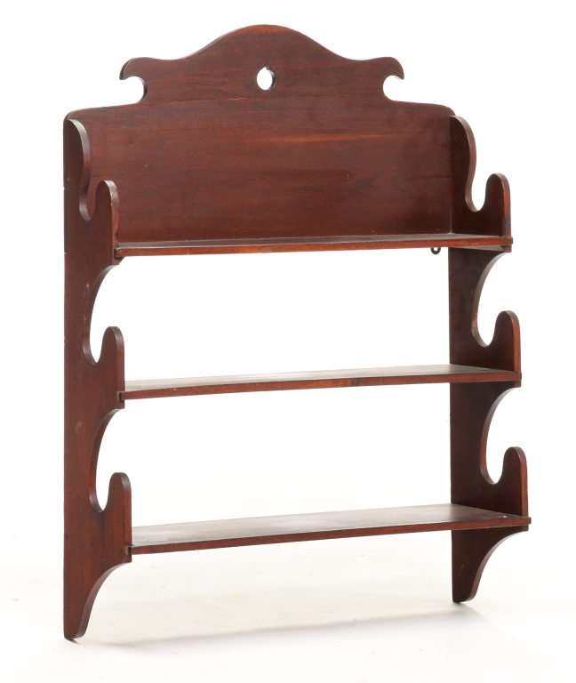 Appraisal: AMERICAN HANGING SHELVES Second half th century walnut Shaped crest