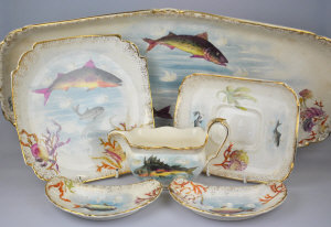 Appraisal: A th century earthenware fish service each piece decorated with