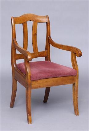 Appraisal: BIEDERMEIER FRUITWOOD OPEN ARMCHAIR The serpentine top above two c-scroll