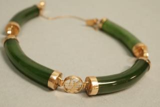 Appraisal: Asian K Gold and Jade Bracelet jade section mounted in