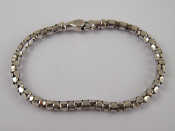 Appraisal: A white metal tests carat gold bracelet with diamond set