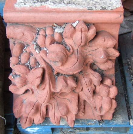 Appraisal: A set of four terracotta architectural elements relief moulded with