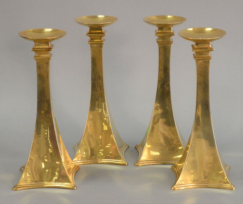 Appraisal: Set of four modern brass candlesticks tapered neck terminates in