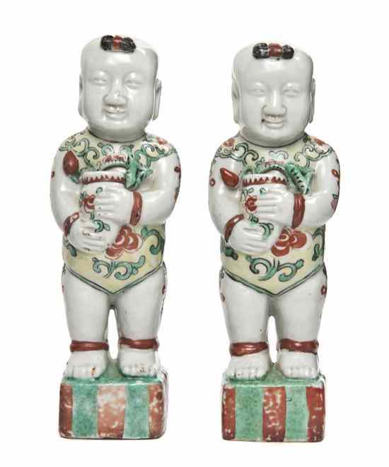 Appraisal: A Pair of Famille Verte Porcelain Hehe Boys the figures