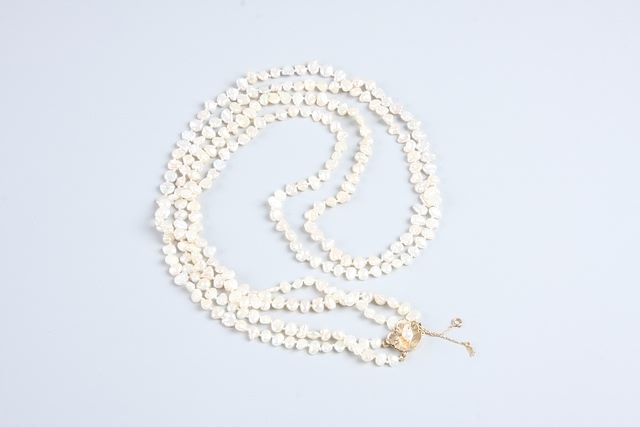 Appraisal: Double strand lustre pearl necklace long With a KY gold