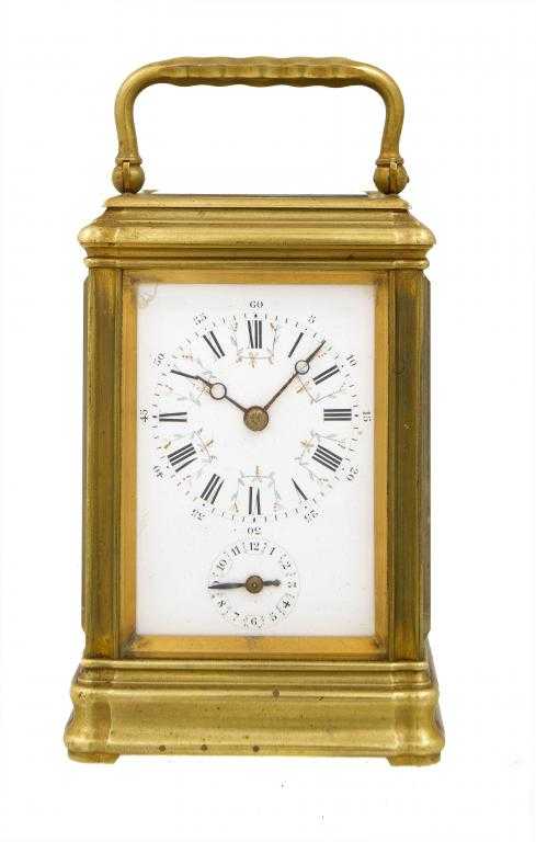 Appraisal: A FRENCH BRASS CARRIAGE CLOCK the enamel mask dial with