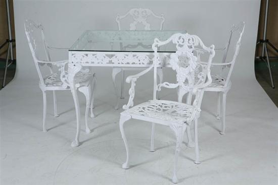 Appraisal: WROUGHT IRON PORCH SET Table with a pierced apron and