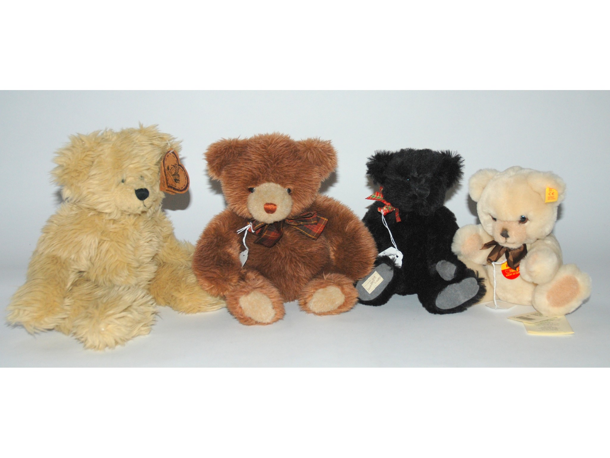 Appraisal: Four various modern teddy bears including Steiff etc