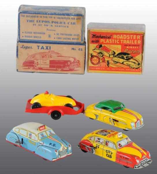 Appraisal: Lot of Tin Plastic Vehicle Wind-Up Toys Description American Circa