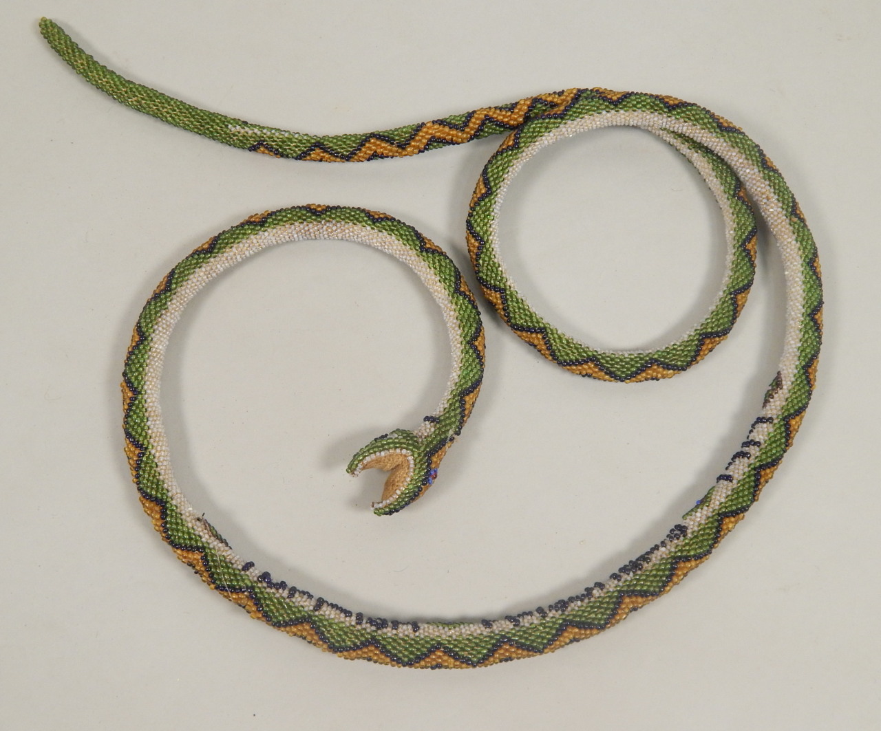 Appraisal: A Turkish WWI prisoner beadwork snake bearing the date