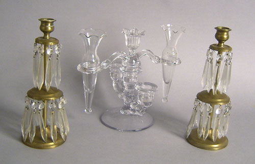 Appraisal: Colorless glass candelabra together with a pair of brass candlesticks