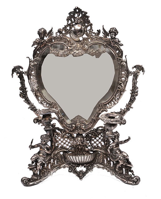 Appraisal: A CONTINENTAL PROBABLY ITALIAN SILVER PLATED HEART SHAPED DRESSING MIRROR