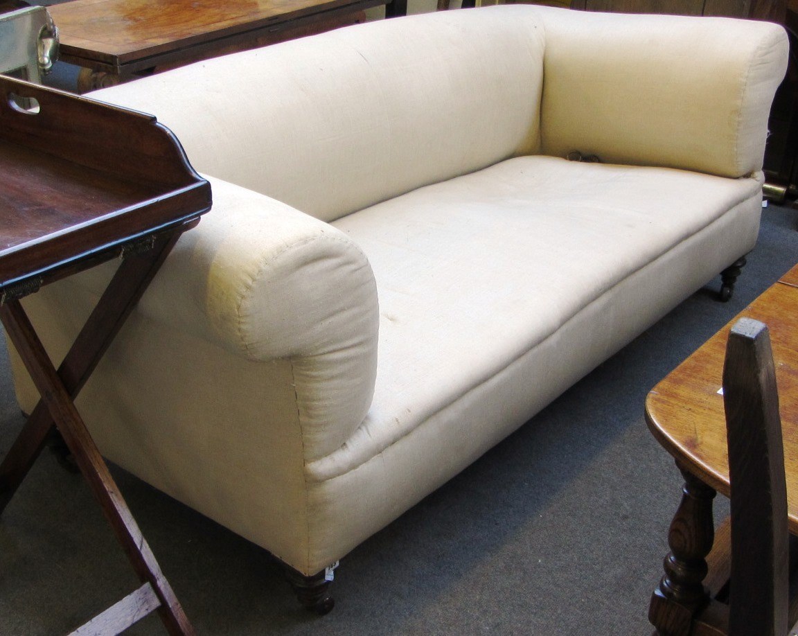 Appraisal: A Victorian low back chesterfield on turned mahogany supports cm