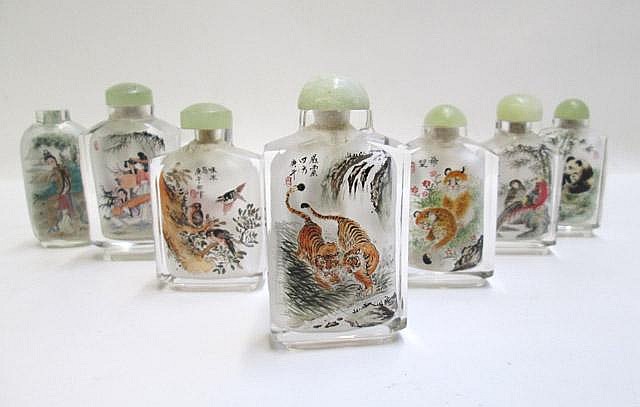 Appraisal: SEVEN GLASS SNUFF BOTTLES with hand painted images of animals