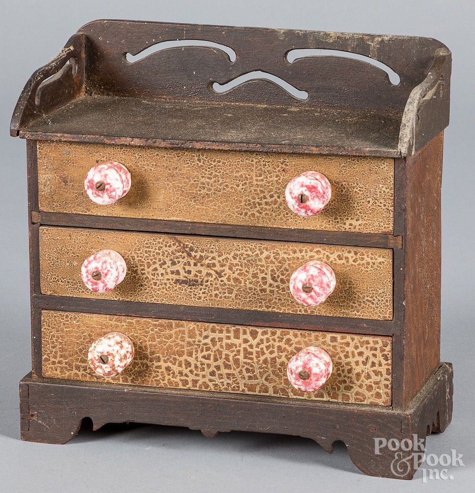 Appraisal: Miniature painted chest of drawers Miniature painted chest of drawers