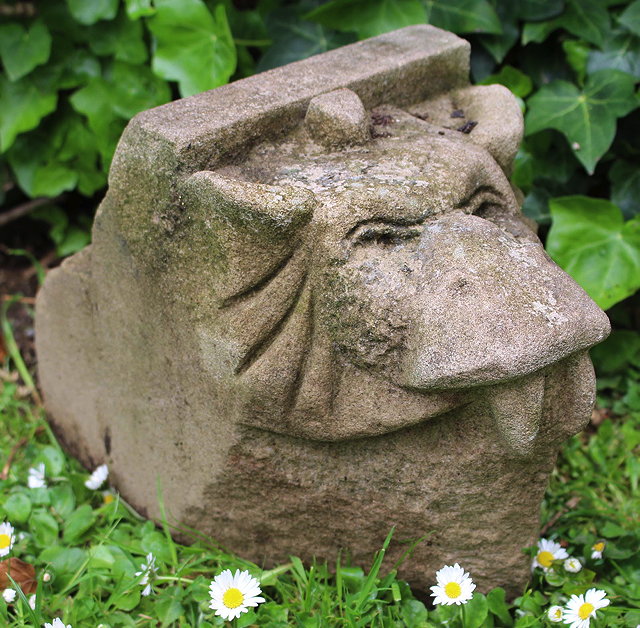 Appraisal: A HAND CARVED STONE CORBEL of a mystical dragons head