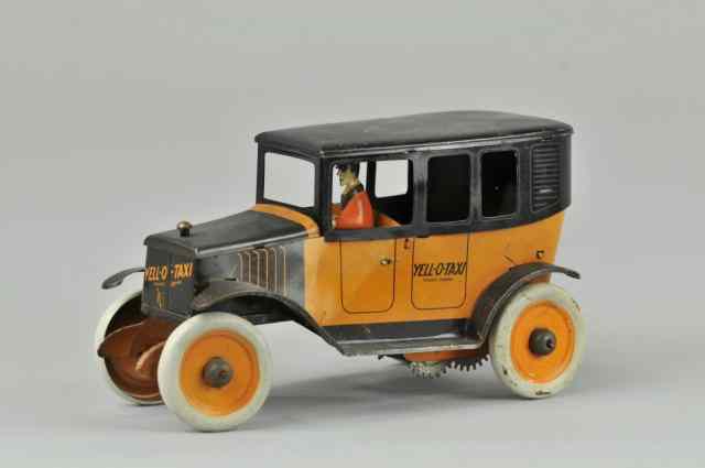 Appraisal: STRAUSS YELL-O-TAXI Lithographed tin done in orange and black seated