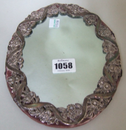 Appraisal: A Turkish silver and red velvet oval mirror the border