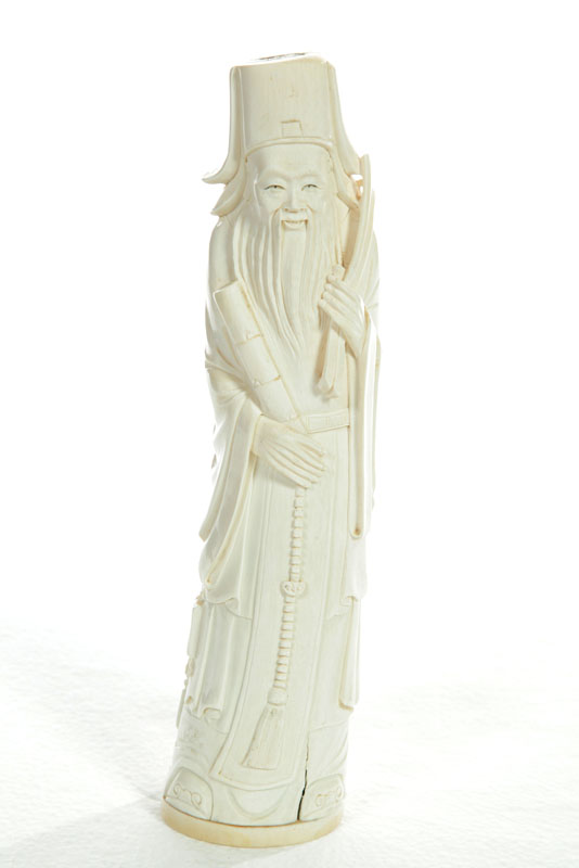 Appraisal: IVORY FIGURE China st half- th century Robed man carrying