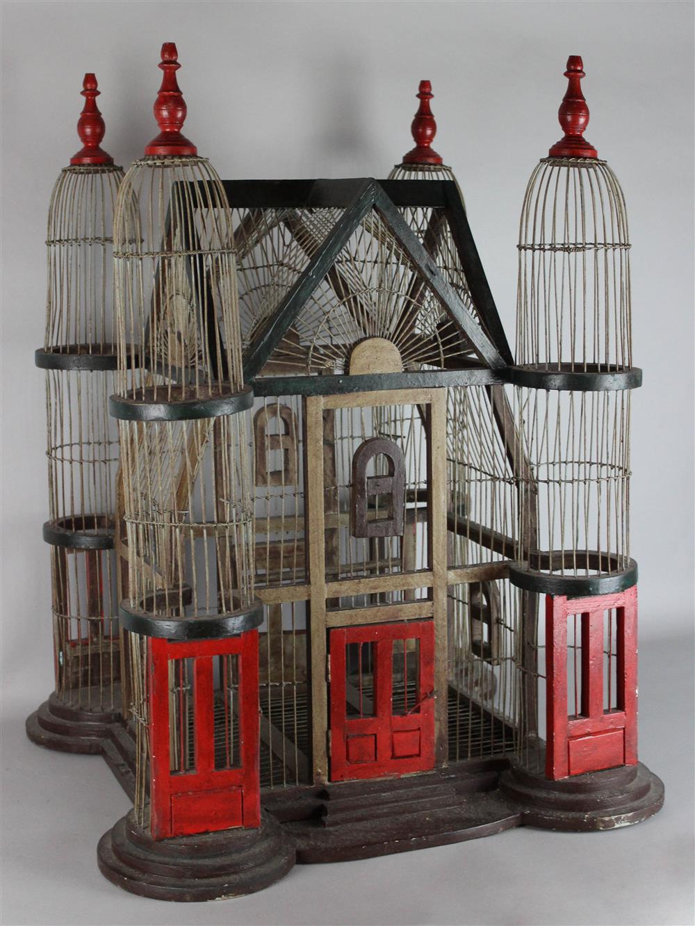 Appraisal: FOLK ART WOOD AND WIRE BIRDCAGE of dramatic scale with